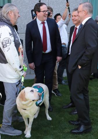 Veteran and Assistance Dog with Prime Minister, the Minister and Assistant Minister of Veterans' Affairs